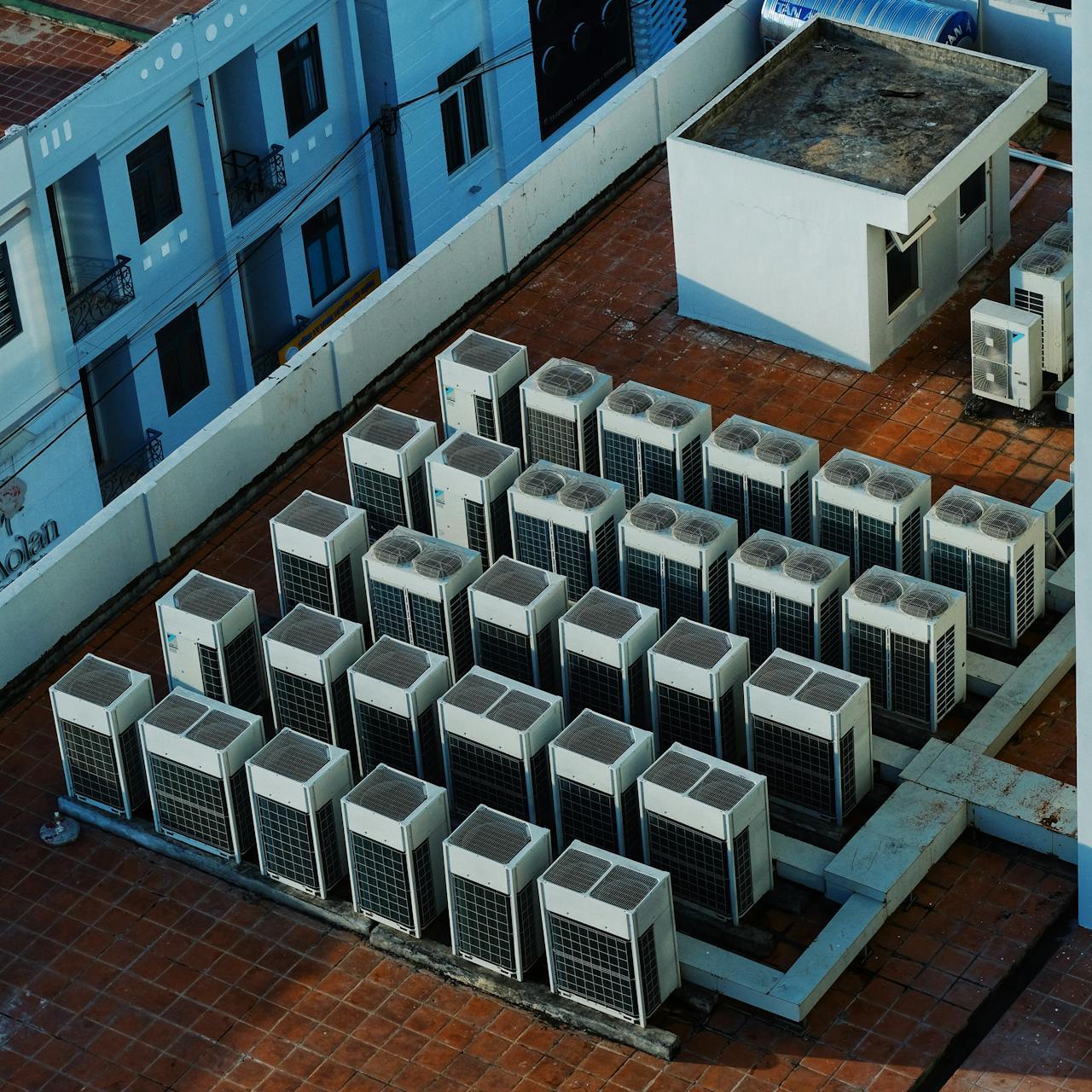 High angle view of rooftop HVAC units on a building in Buon Ma Thuot, Vietnam.